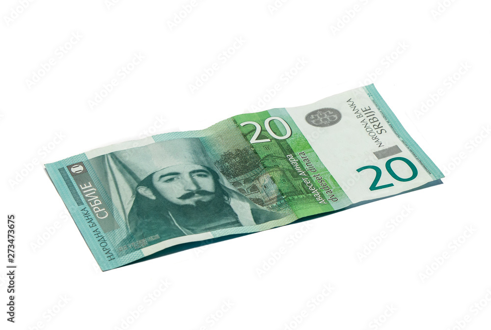 One banknote worth 20 Serbian Dinars with a portrait of the ruler of Montenegro Peter II Petrovich isolated on a white background One banknote worth 20 Serbian Dinars with a portrait of the ruler of Montenegro Peter II Petrovich isolated on a white background