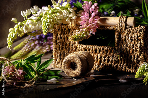Fresh flowers  leaves  and tools to create a bouquet on a table  florist s workplace