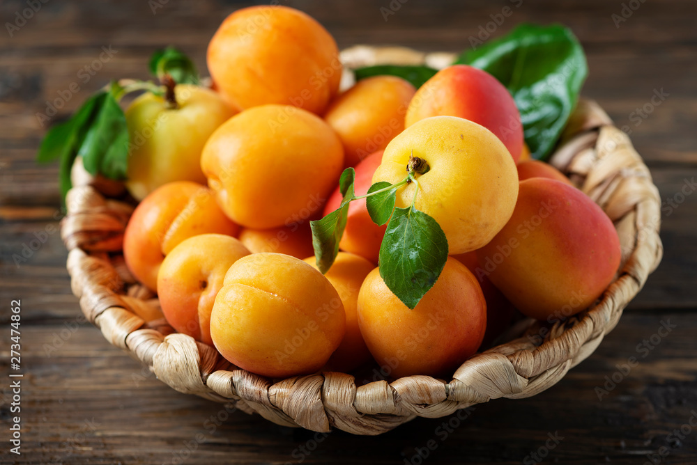 Sweet apricots on the wooden table