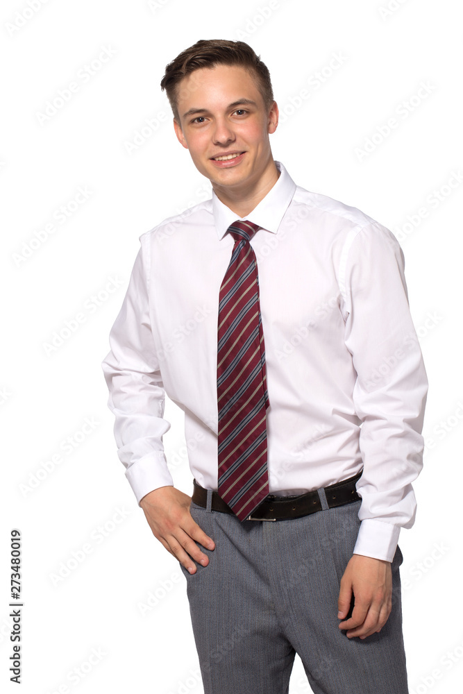 A handsome confident young man standing and smiling in a white shirt isolated on white. A handsome confident young man standing and smiling in a white shirt isolated on white.