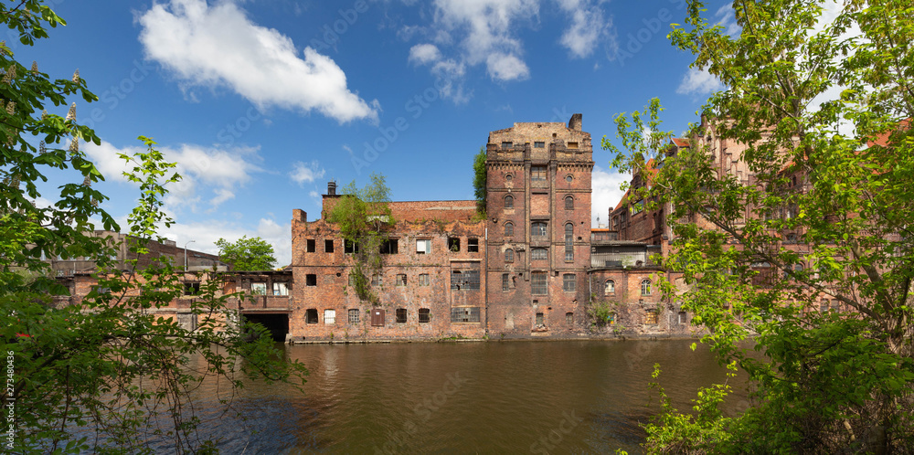 Obraz premium Szczecin. Old factories on the Odra River in the historic part of the city