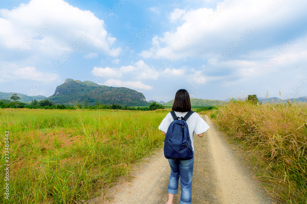 Young cute Asian Japanese girl hipster backpack women travelling looking at beautiful sky mountains scenery views 