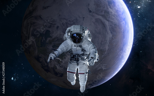 Astronaut on background of Earth. Solar system. Science fiction. Elements of this image furnished by NASA