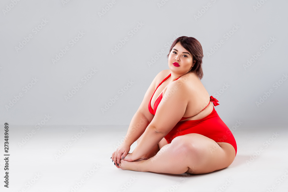 Plus size model in red lingerie, fat woman in underwear on gray background,  body positive concept Photos | Adobe Stock