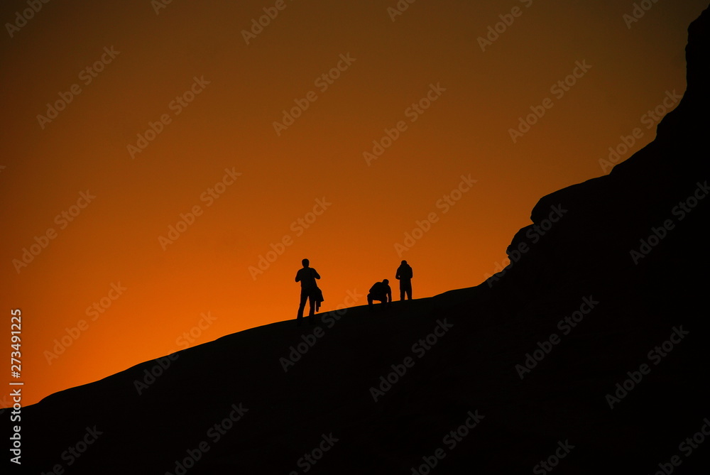 silhouette of a man on top of the mountain