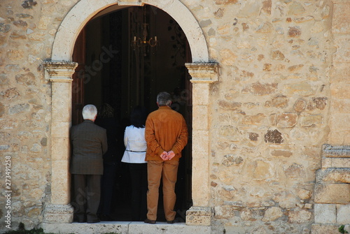 Group of people waiting at the entrance of a church