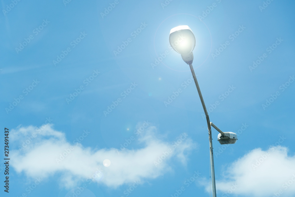 The lamp shines under the blue sky. The lamp shines under the blue sky.
