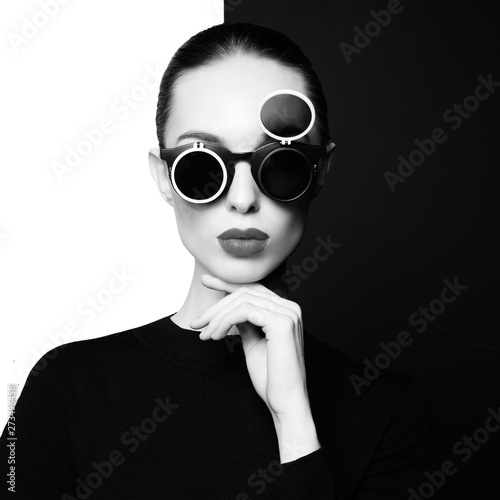 beautiful young woman with black sunglasses photo