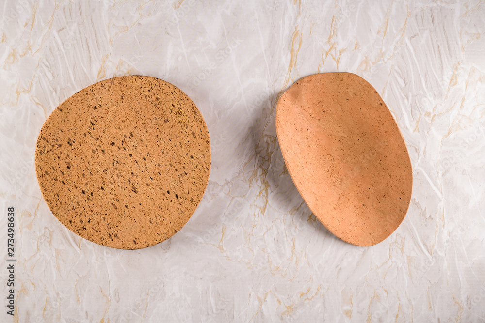 Two cork plates on a gray marble background Two cork plates on a gray marble background