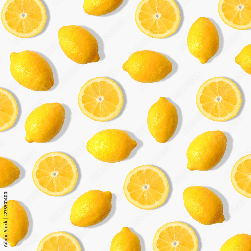 Summer fruit pattern of lemons and lemon slices on a white background