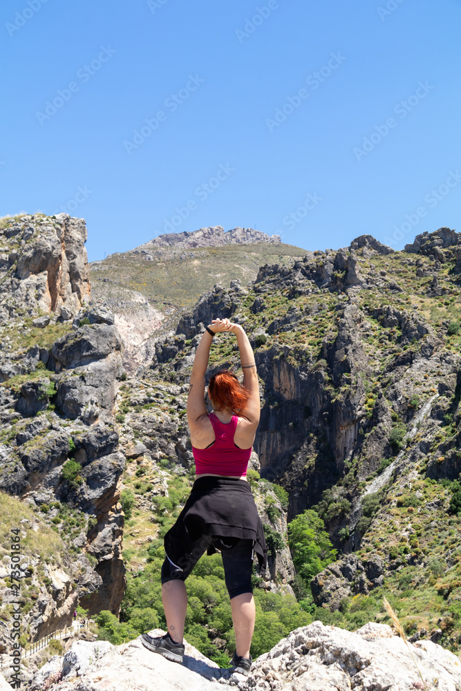 Strong girl at the mountain in Sierra Nevada