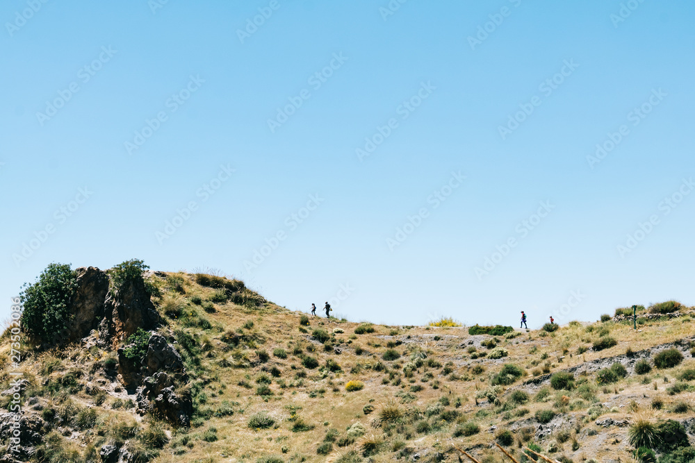 Fototapeta premium People walking at Los Cahorros, Granada, Spain