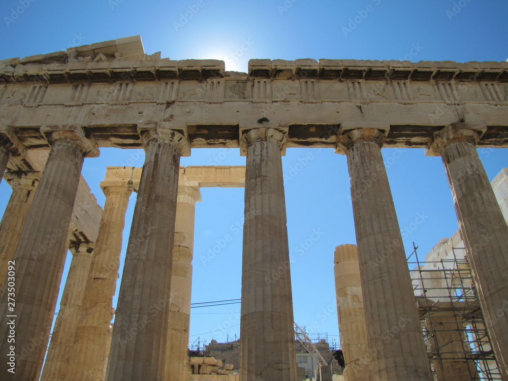 Columns of Parthenon against the Sun in Acropolis in Athens, Greece