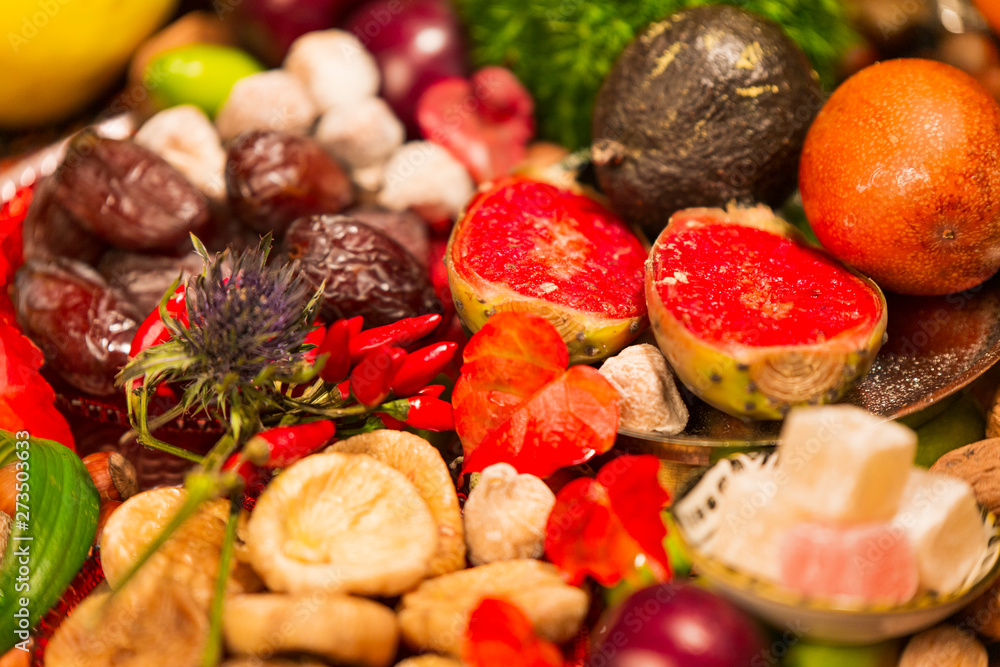 Close Up of Table decorated with Autumn and Winter Fruits and Edibles Close Up of Table decorated with Autumn and Winter Fruits and Edibles