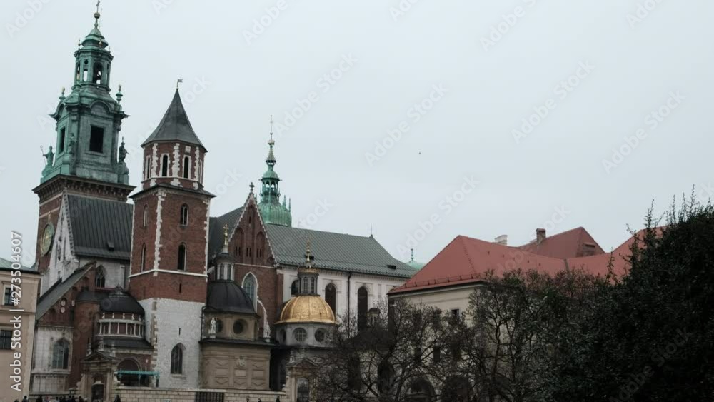 Beautiful towers of the cathedral in the city. Old Architecture of Krakow Poland Beautiful towers of the cathedral in the city. Old Architecture of Krakow Poland