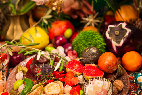 Close Up of Table decorated with Autumn and Winter Fruits and Edibles