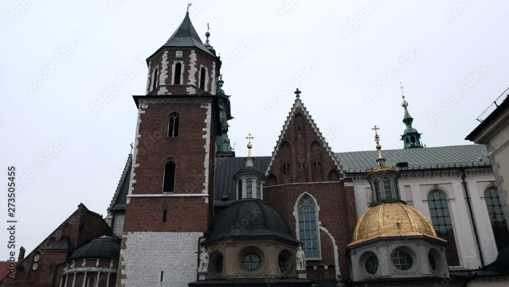 Beautiful towers of the cathedral in the city. Old Architecture of Krakow Poland Beautiful towers of the cathedral in the city. Old Architecture of Krakow Poland