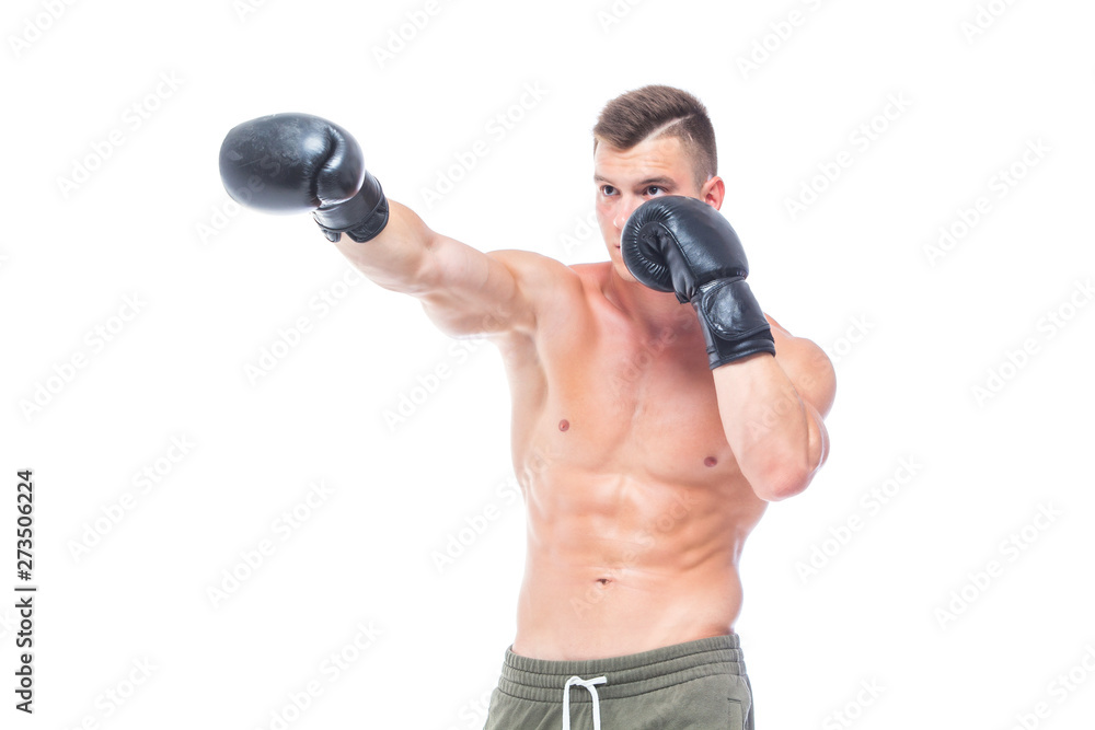 Muscular young man in black boxing gloves and shorts shows the different movements and strikes in the studio on a white background. Strong Athletic Man - Fitness Model showing his perfect body. Copy Muscular young man in black boxing gloves and shorts shows the different movements and strikes in the studio on a white background. Strong Athletic Man - Fitness Model showing his perfect body. Copy