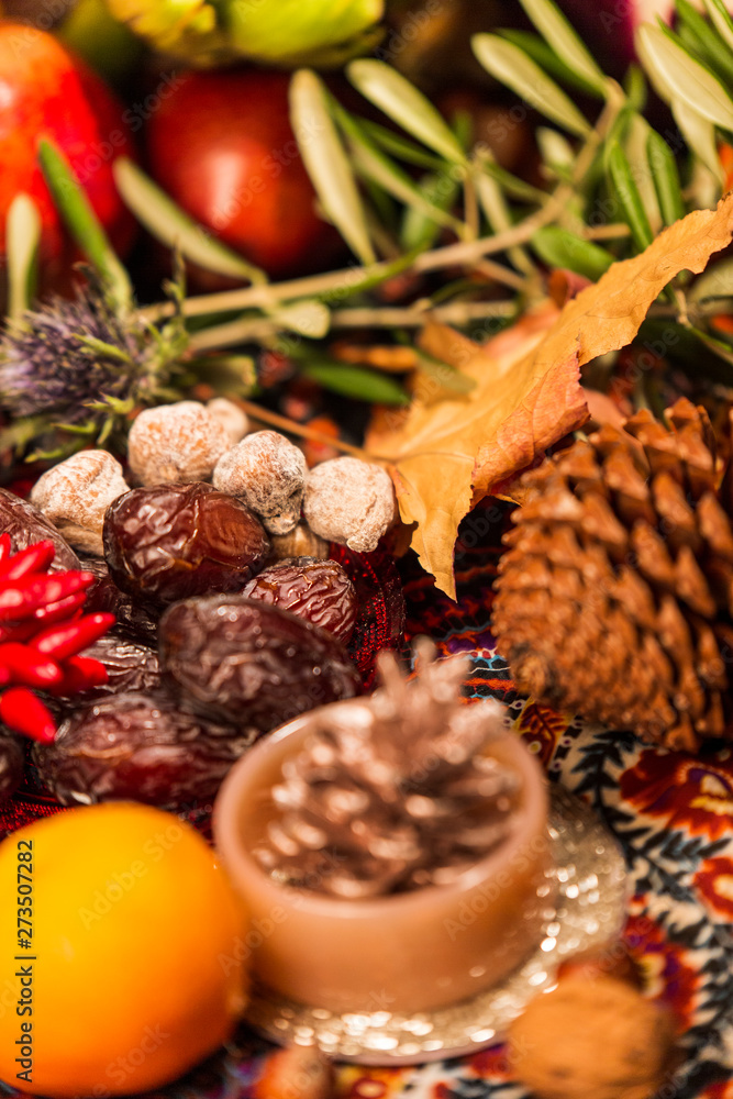 Close Up of Table decorated with Autumn and Winter Fruits and Edibles