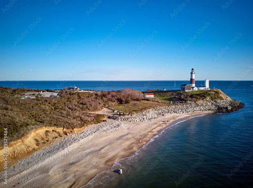 Montauk Lighthouse and beach aerial shot, Long Island, New York, USA.