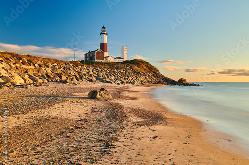Montauk Lighthouse and beach at sunrise, Long Island, New York, USA.