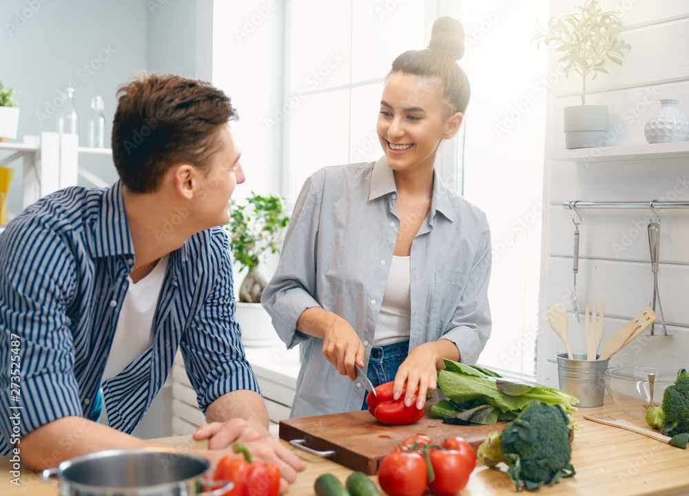 loving couple is preparing the proper meal loving couple is preparing the proper meal