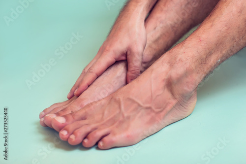 Man feels strong foot pain. People  healthcare and medicine concept