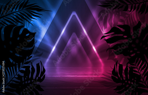 Background of empty dark scenes with neon lights and shapes  smoke. Silhouettes of tropical palm leaves in the foreground. Bright futuristic abstract background