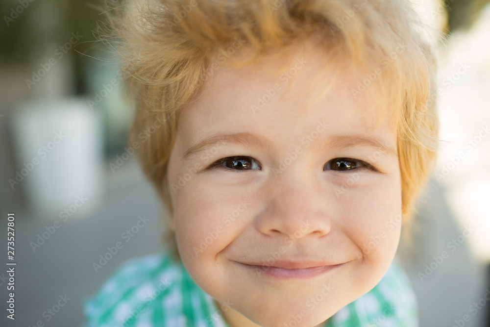 Photo of adorable young happy boy looking at camera. Happy funny child face close up. Super smile from kid. Happiness. Photo of adorable young happy boy looking at camera. Happy funny child face close up. Super smile from kid. Happiness.