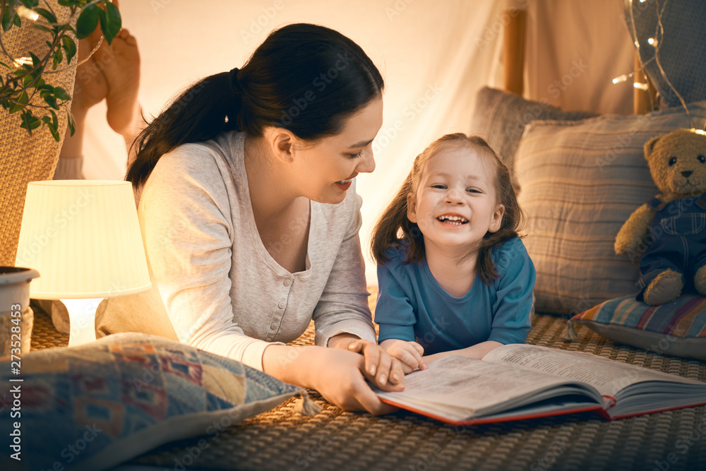 mother and daughter playing in tent mother and daughter playing in tent