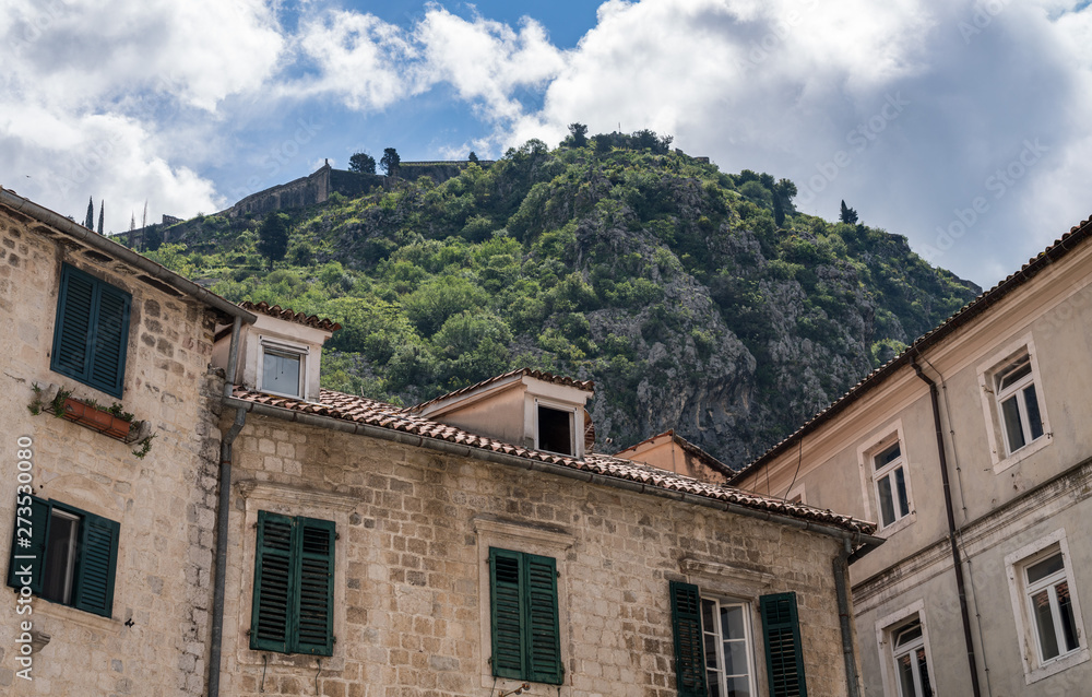 Green shutters on house in streets of old town Kotor in Montenegro