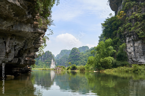 River, karst mountains and tropical forest in Trang An, Tam Coc, Ninh Binh, Vietnam.