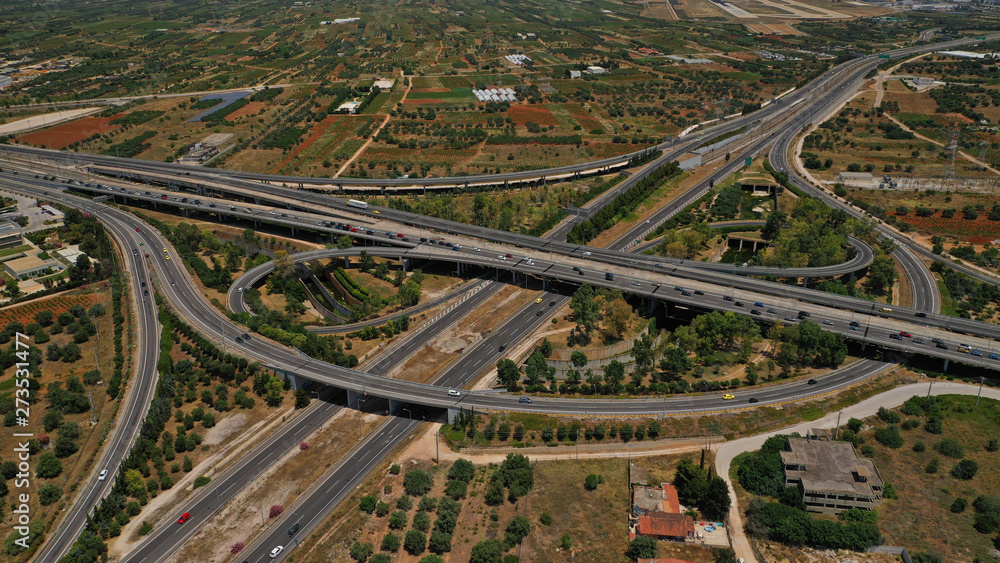 Aerial photo of multilevel junction highway crossing with high speed national road at rush hour Aerial photo of multilevel junction highway crossing with high speed national road at rush hour