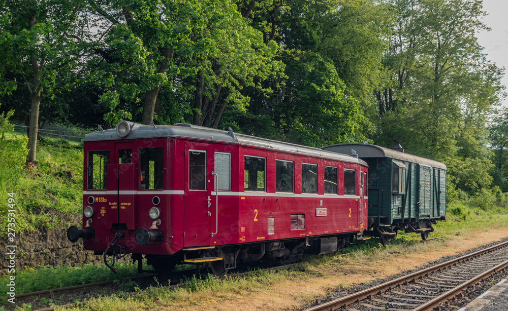 Red old historical diesel train with cargo green car in Ceska Kamenice town Red old historical diesel train with cargo green car in Ceska Kamenice town