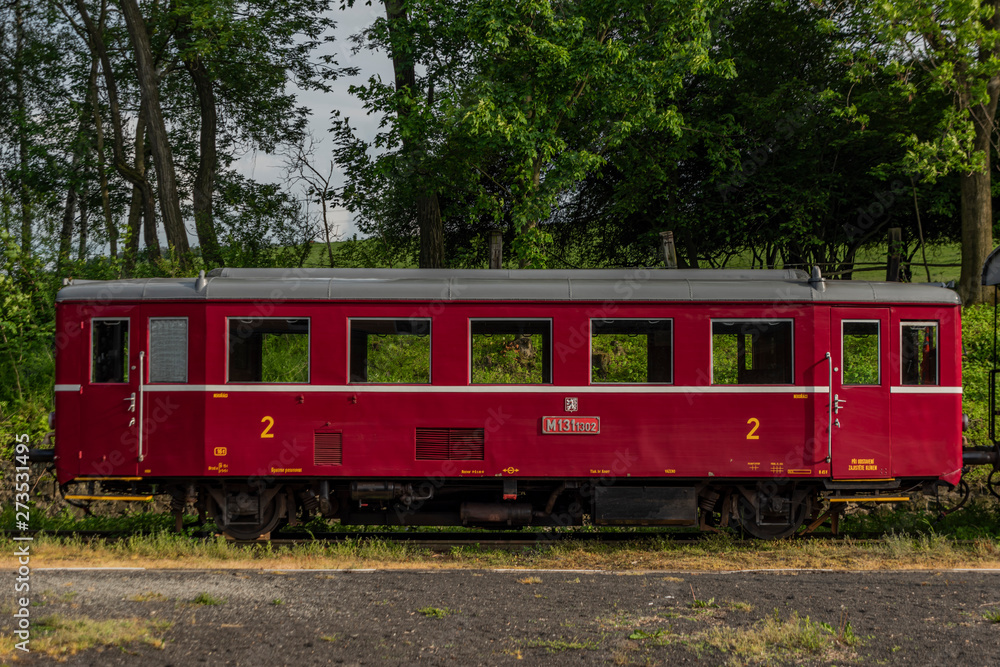 Red old historical diesel train with cargo green car in Ceska Kamenice town