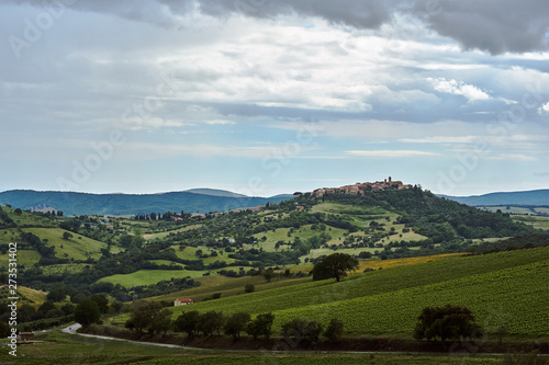 Rural landscape with buildings of the city on a hill in Tuscany, Italy..