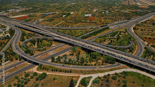 Aerial photo of multilevel junction highway crossing with high speed national road at rush hour