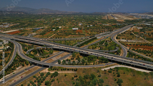 Aerial photo of multilevel junction highway crossing with high speed national road at rush hour