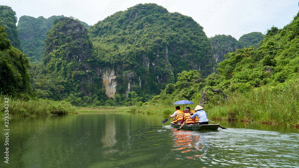 Boat tour, beautiful landscape with karst mountains and river in Trang An, Ninh Binh, Tam Coc, Vietnam. 