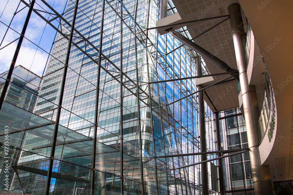 London, UK. Office building entrance hall in Canary Wharf. View at the Canada Tower. Beautiful glass reflection 