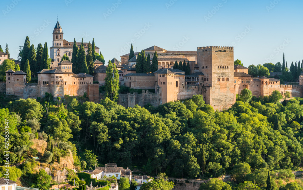 Panoramic sight of the Alhambra Palace in Granada in the late afternoon sun. Andalusia, Spain.