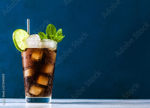 Coca Coke cocktail in a tall glass cuba libre. refreshing summer drink