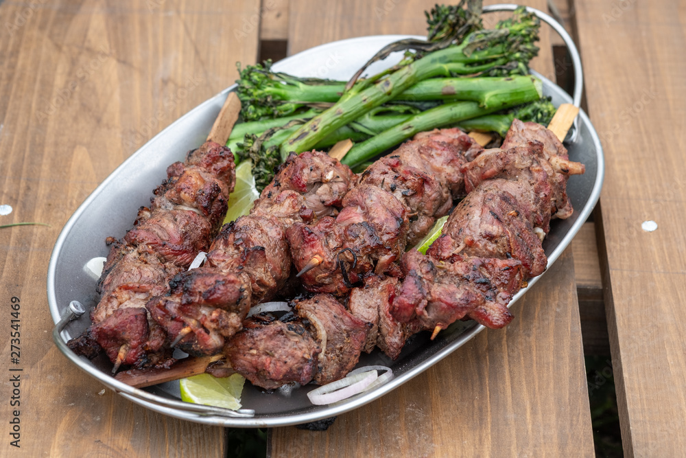 Grilled lamb meat kebabs with green broccolini Grilled lamb meat kebabs with green broccolini