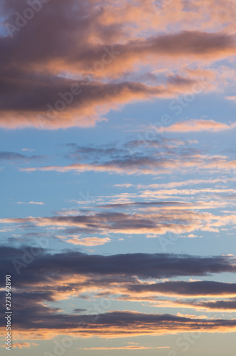 Sunset in the evening sky. Clouds on blue sky © Uran Torpedonoscev