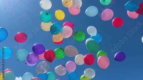 Many colorful balloons flying in the air. Celebration and birthday concept
