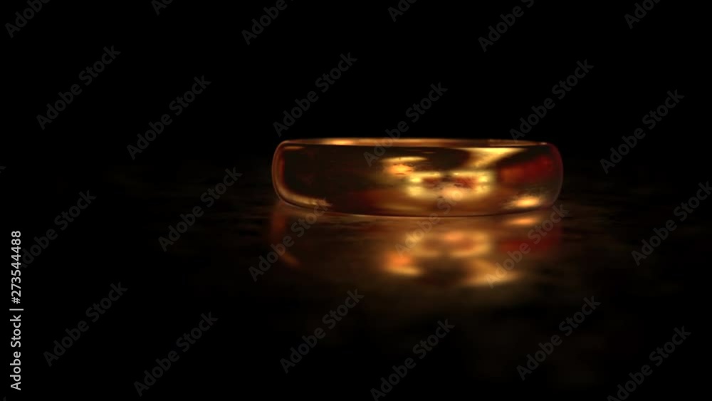 Flying around the gold ring on the matte glass surface with reflection Flying around the gold ring on the matte glass surface with reflection