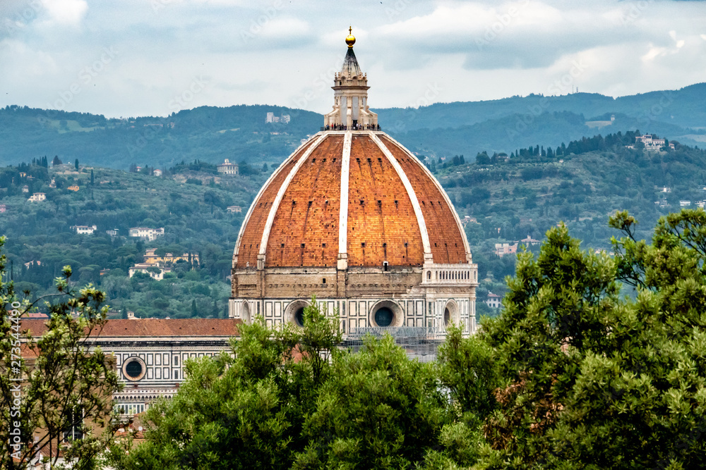 View of the Duomo, at the Florence Cathedral, as viewed from a nearby hillside.  - obrazy, fototapety, plakaty 
