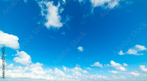 blue sky with white, soft clouds in the summer