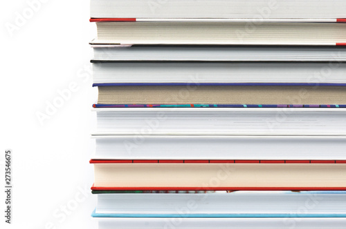 Books laid horizontally on a white background, aligned in a line