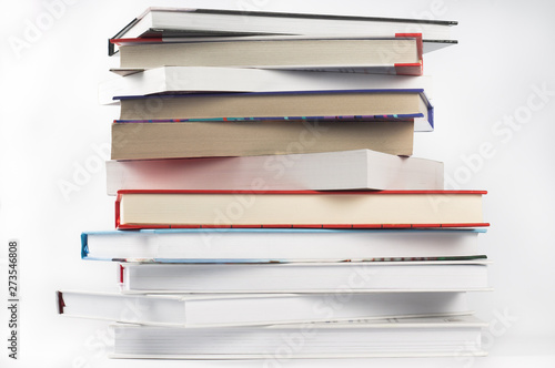 Books stacked in a pile on white background